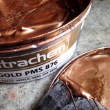 An open can of copper ink ready to print Art Nouveau letterpress coasters