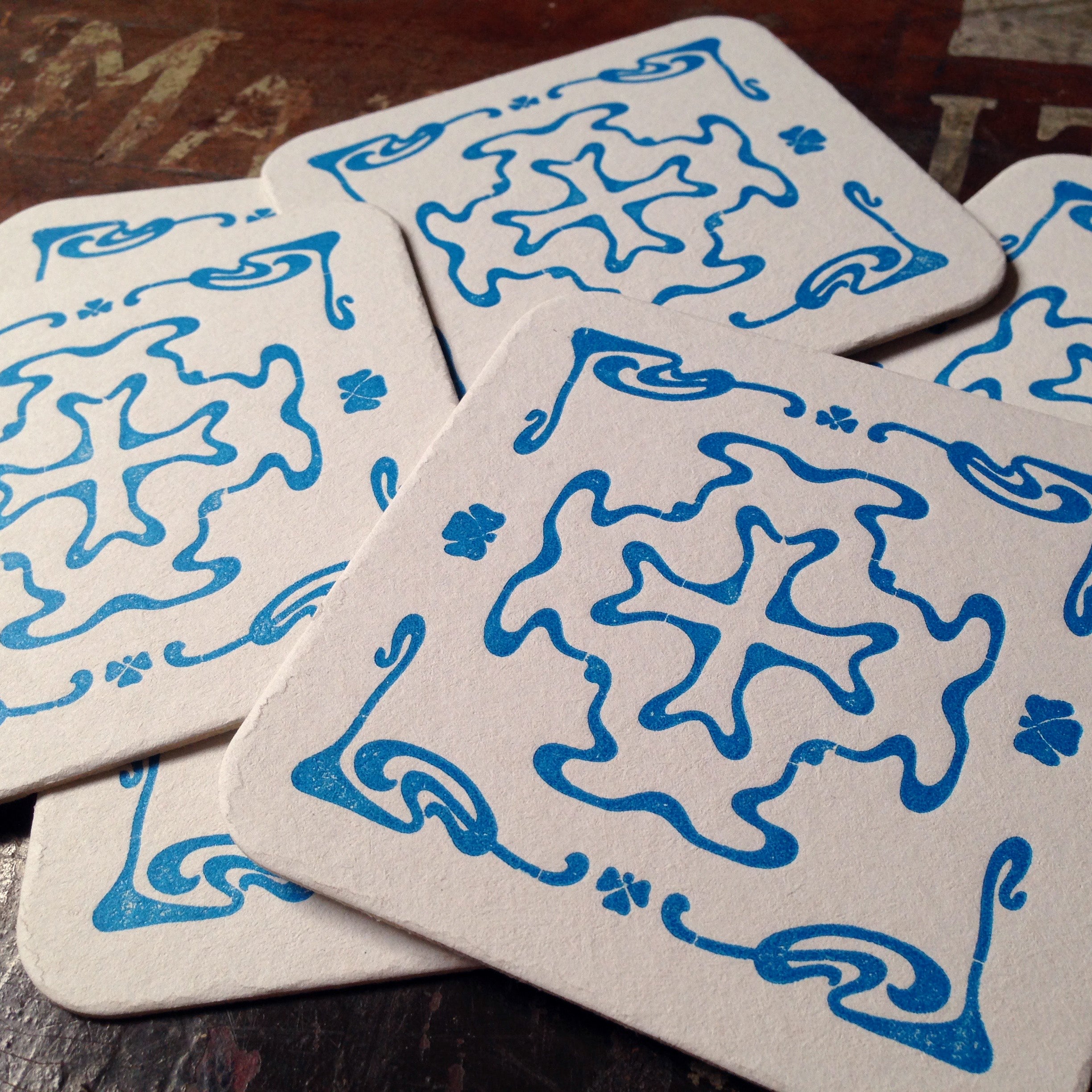 Art Nouveau cross pattern letterpress coaster, blue