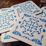 Art Nouveau cross pattern letterpress coaster, blue