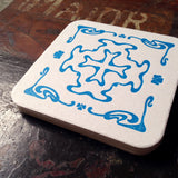 Art Nouveau cross pattern letterpress coaster, blue