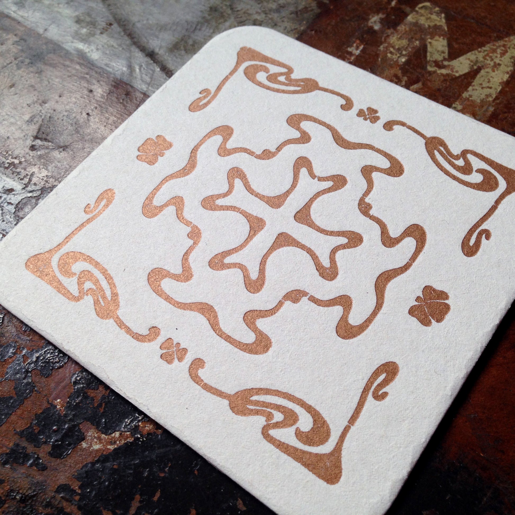 Art Nouveau cross pattern letterpress coaster, copper