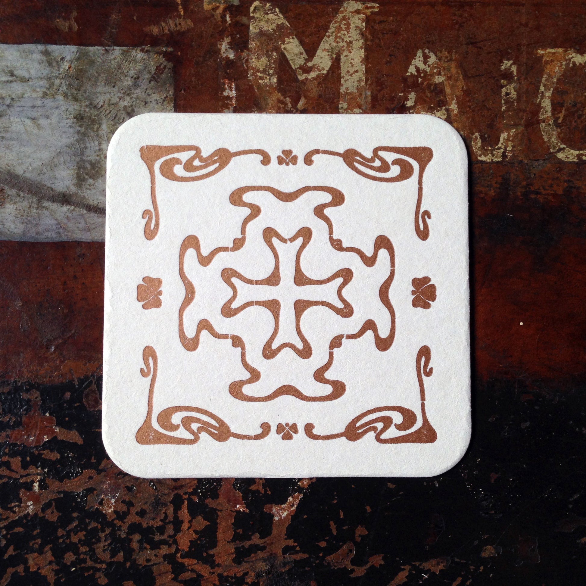 Art Nouveau cross pattern letterpress coaster, copper