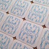 Art Nouveau panel pattern letterpress coaster, blue