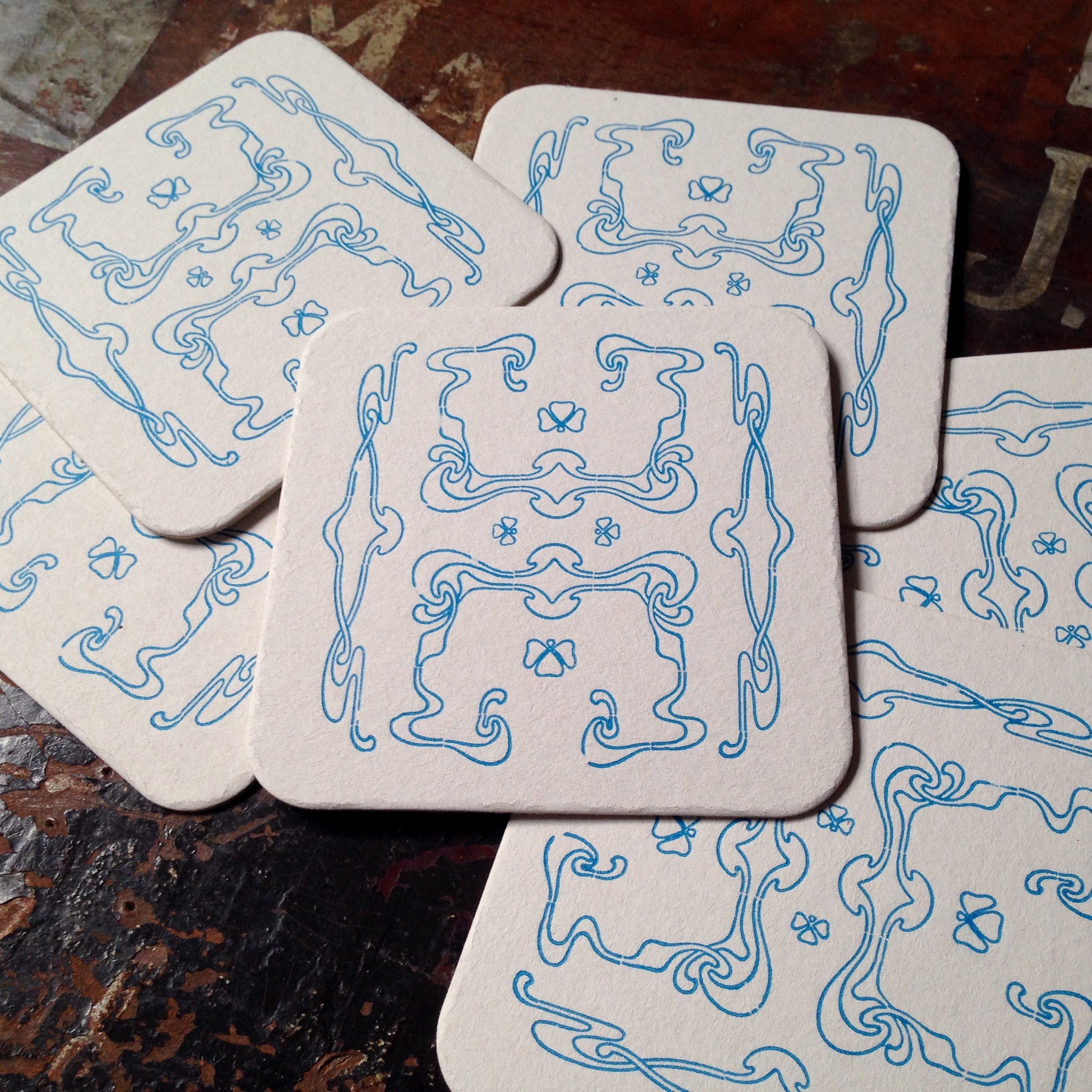 Art Nouveau panel pattern letterpress coaster, blue