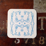 Art Nouveau panel pattern letterpress coaster, blue