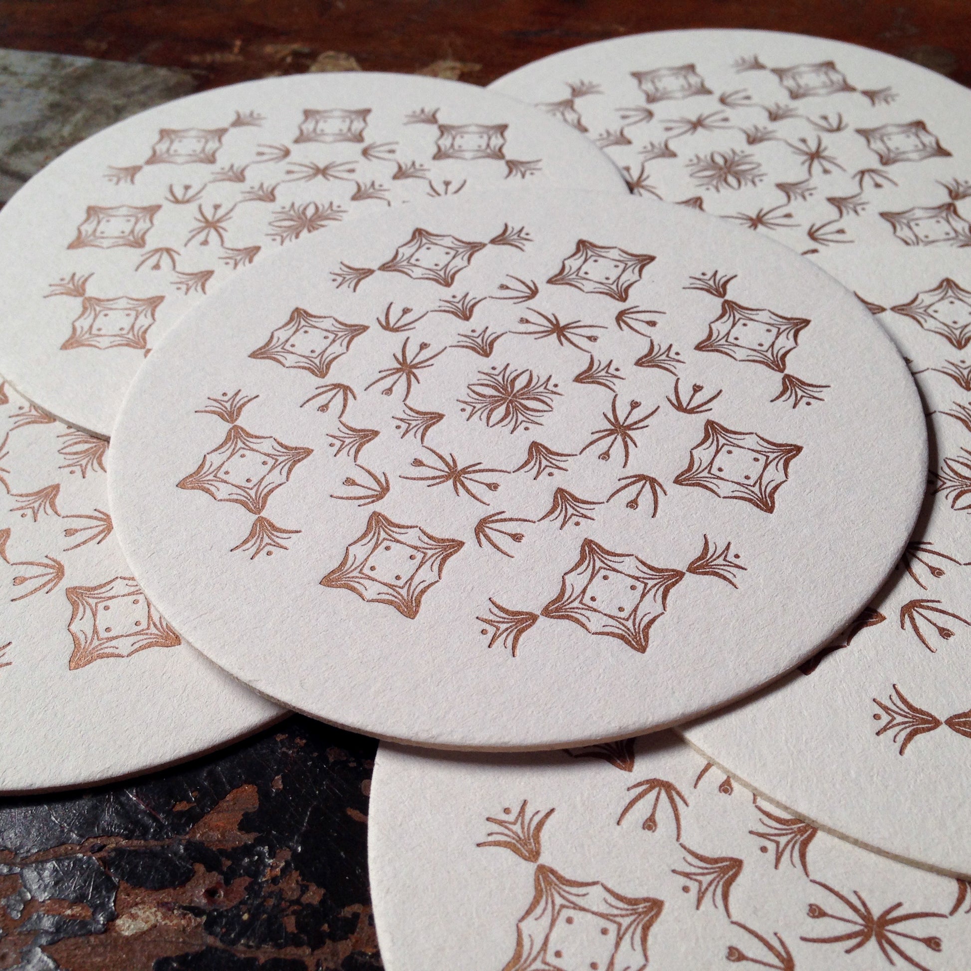 Glint ornament letterpress coaster, copper
