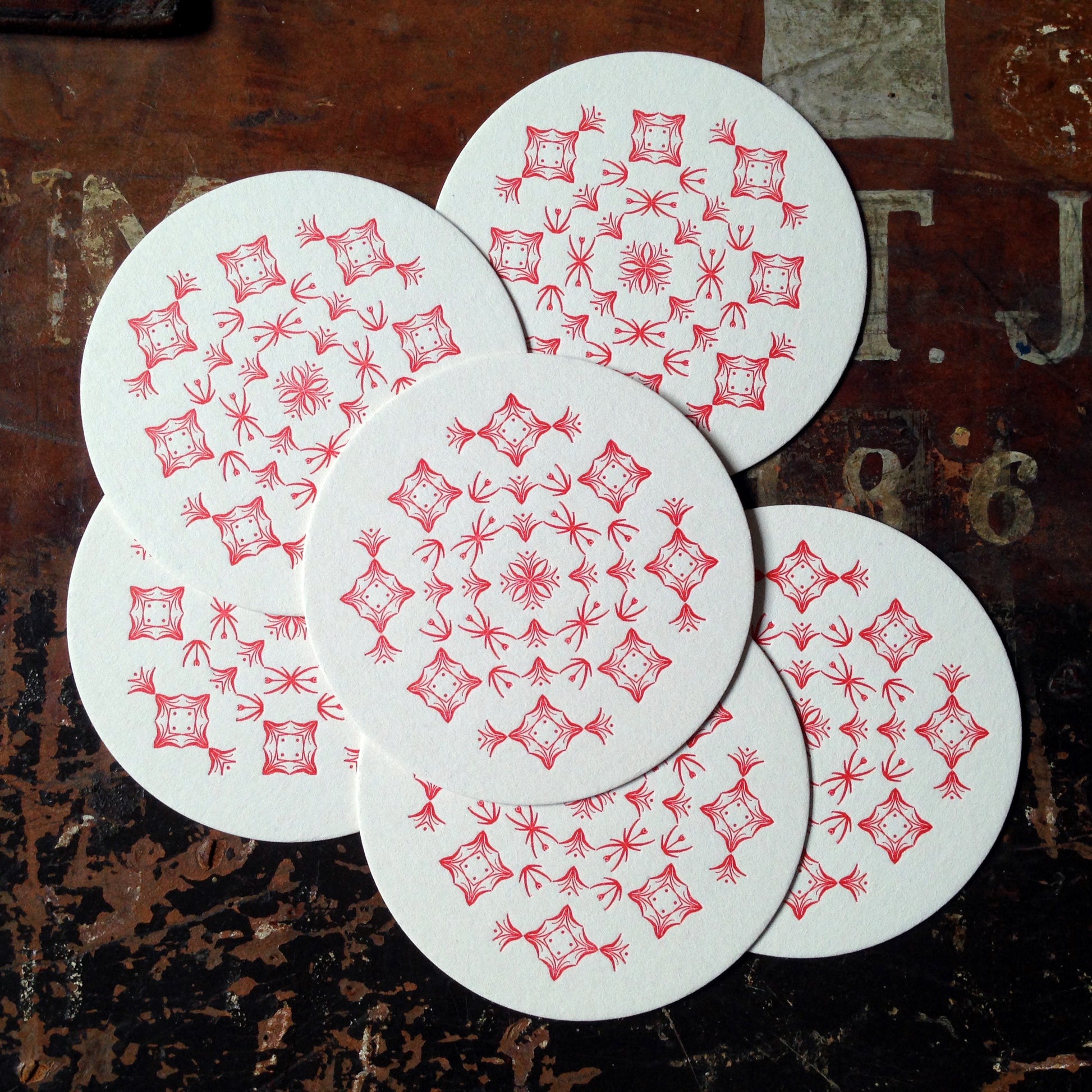 Glint ornament letterpress coaster, red