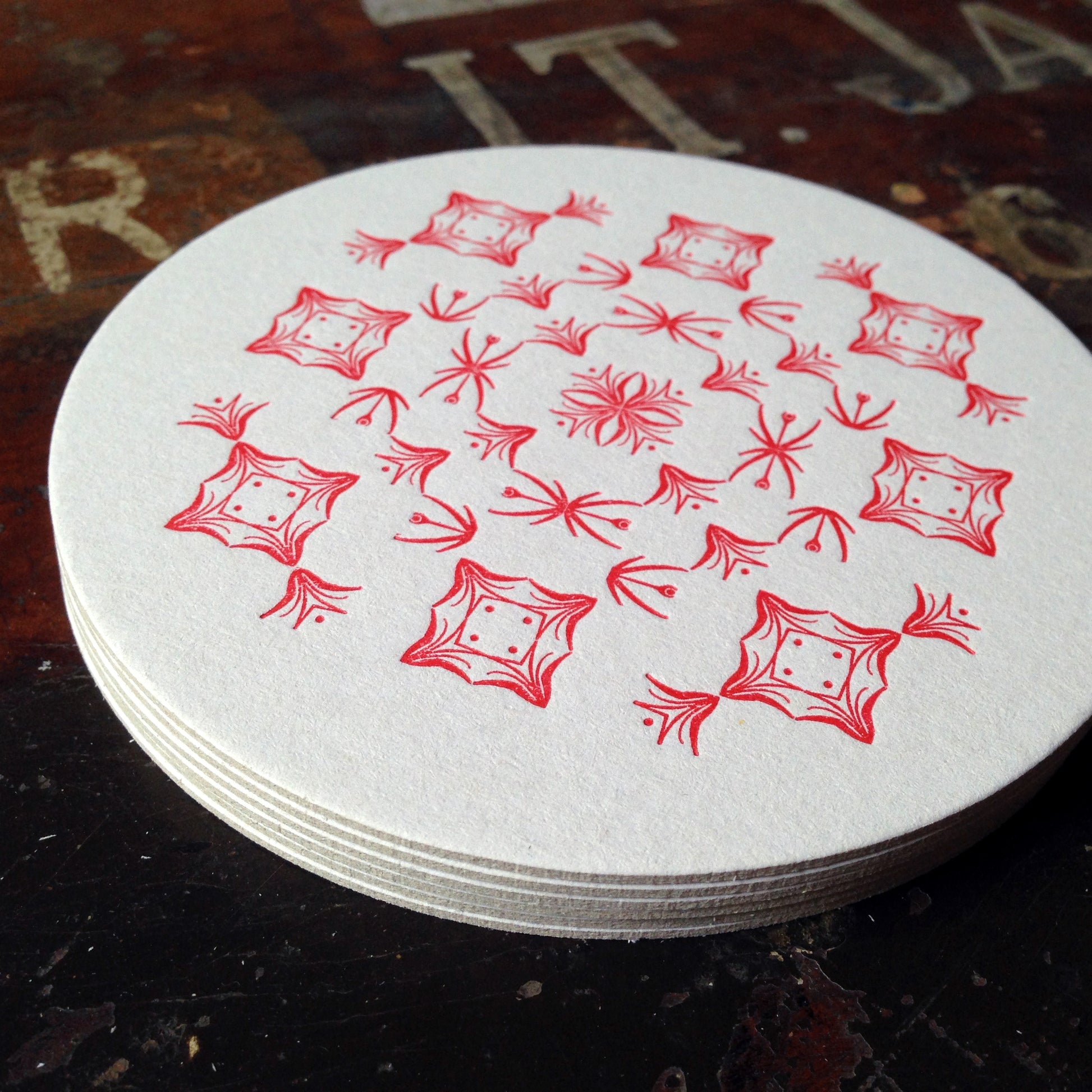Glint ornament letterpress coaster, red